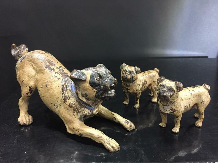 bronze miniatures of 3 pugs